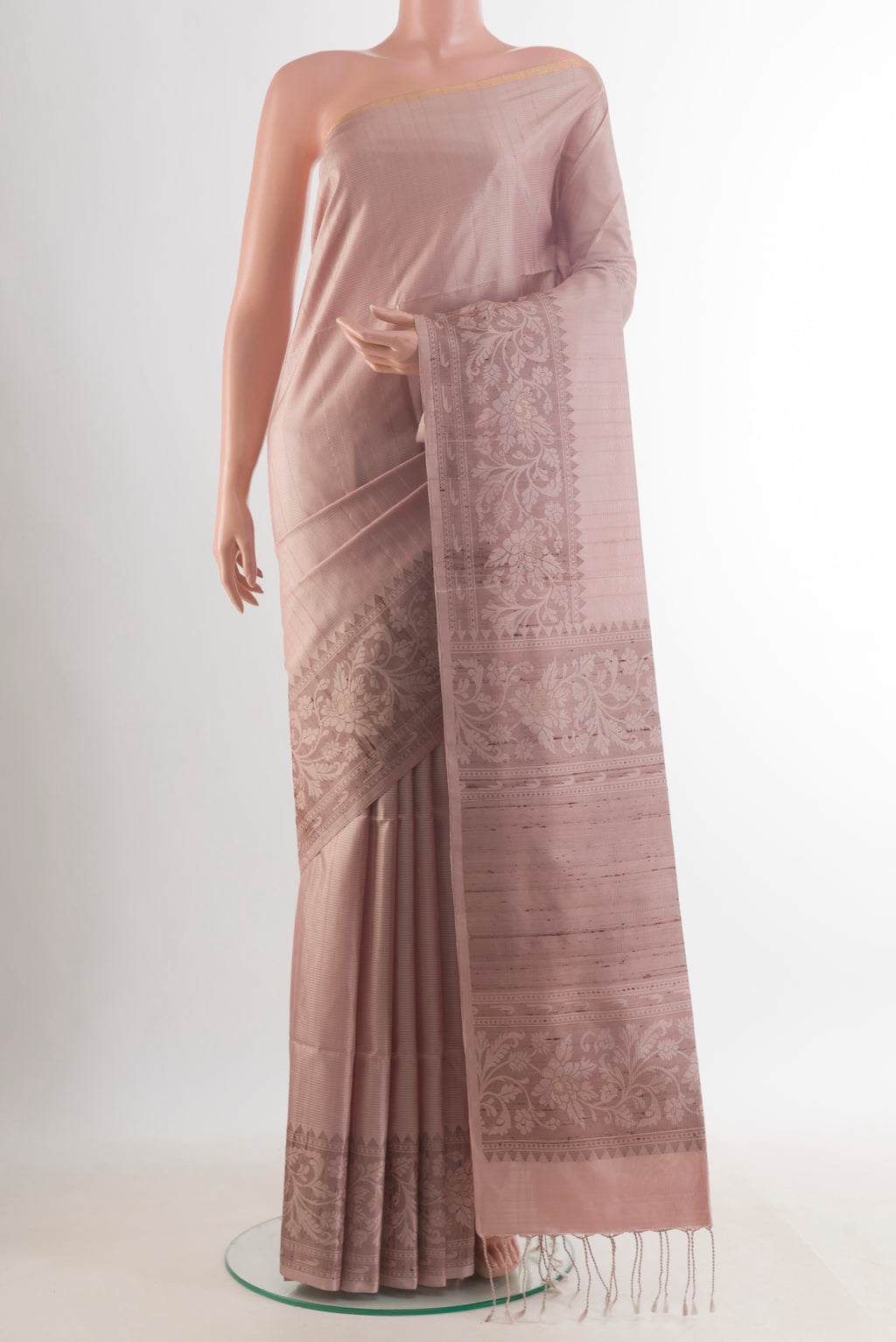 Pure Silk Rose Gold Soft Saree with Stripes on the body and Zari Border.  displayed on a mannequin