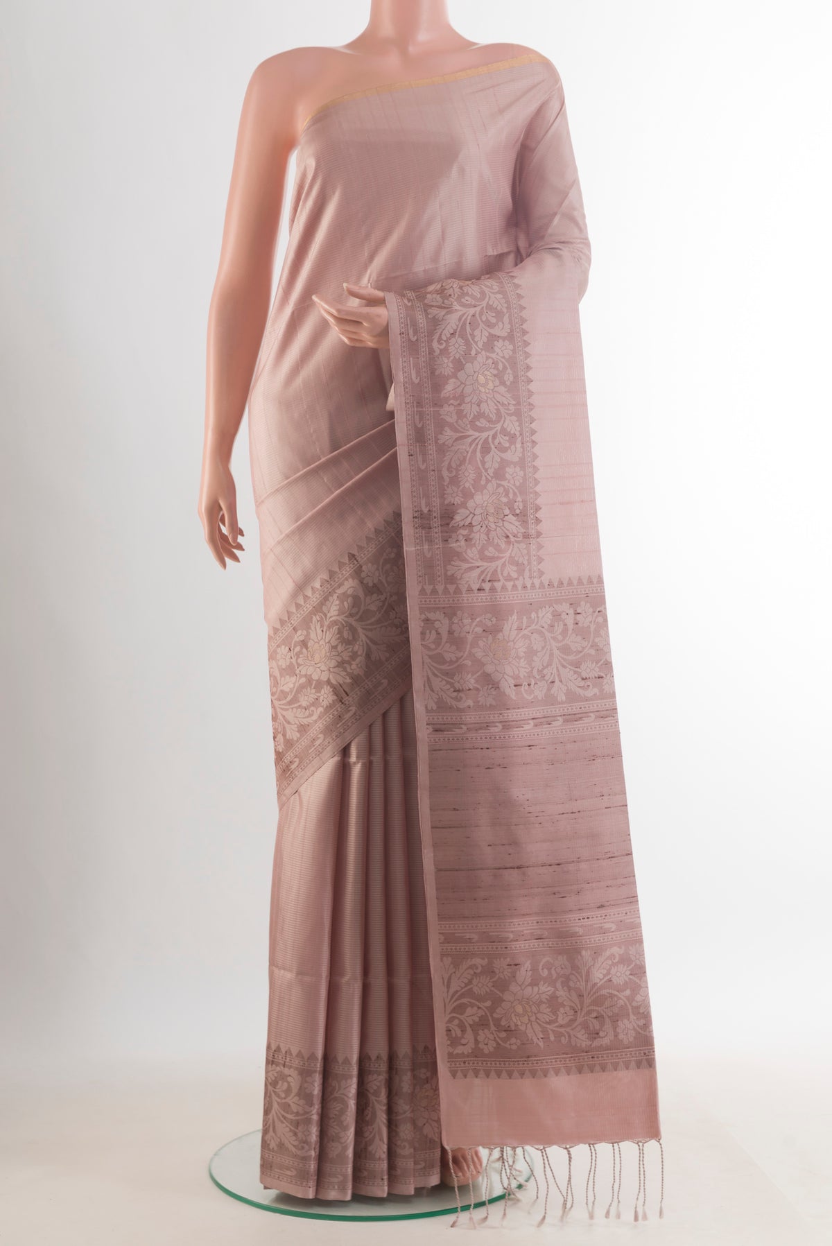 Pure Silk Rose Gold Soft Saree with Stripes on the body and Zari Border.  displayed on a mannequin
