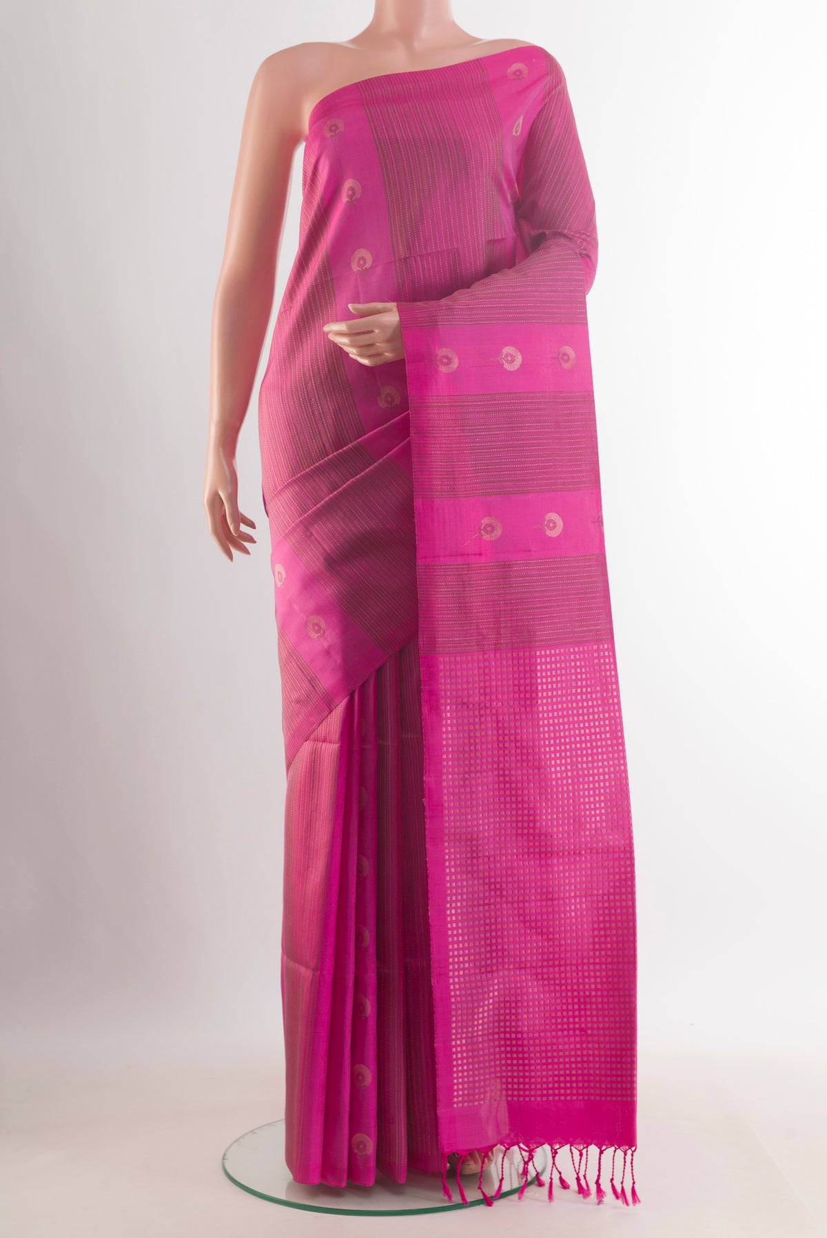 Pure Silk Pink Soft Saree with Stripes on the body and Without Border.  displayed on a mannequin