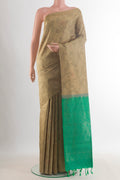 Pure Silk Beige Soft Saree with Thread Butta on the body and Without Border.  displayed on a mannequin
