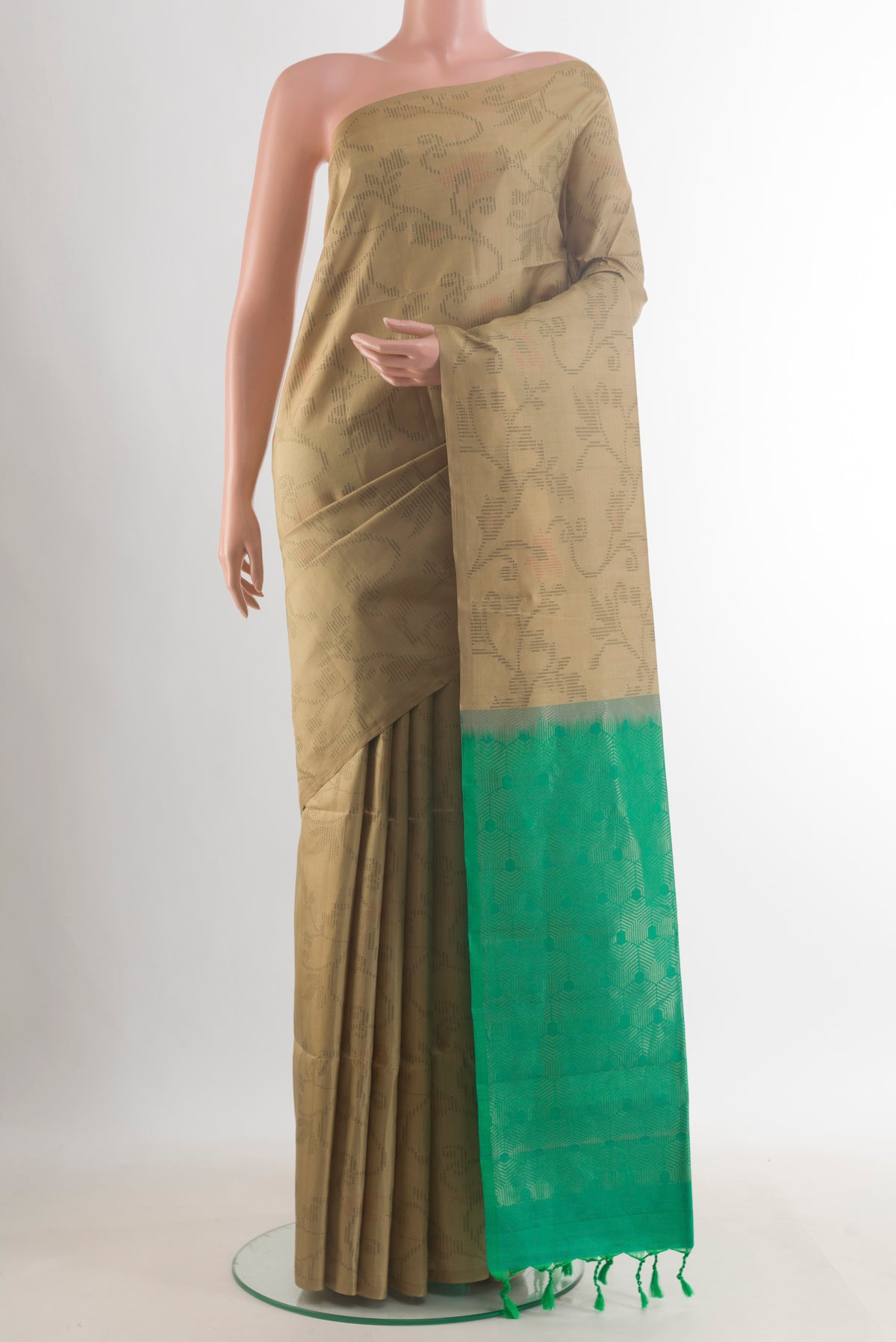 Pure Silk Beige Soft Saree with Thread Butta on the body and Without Border.  displayed on a mannequin