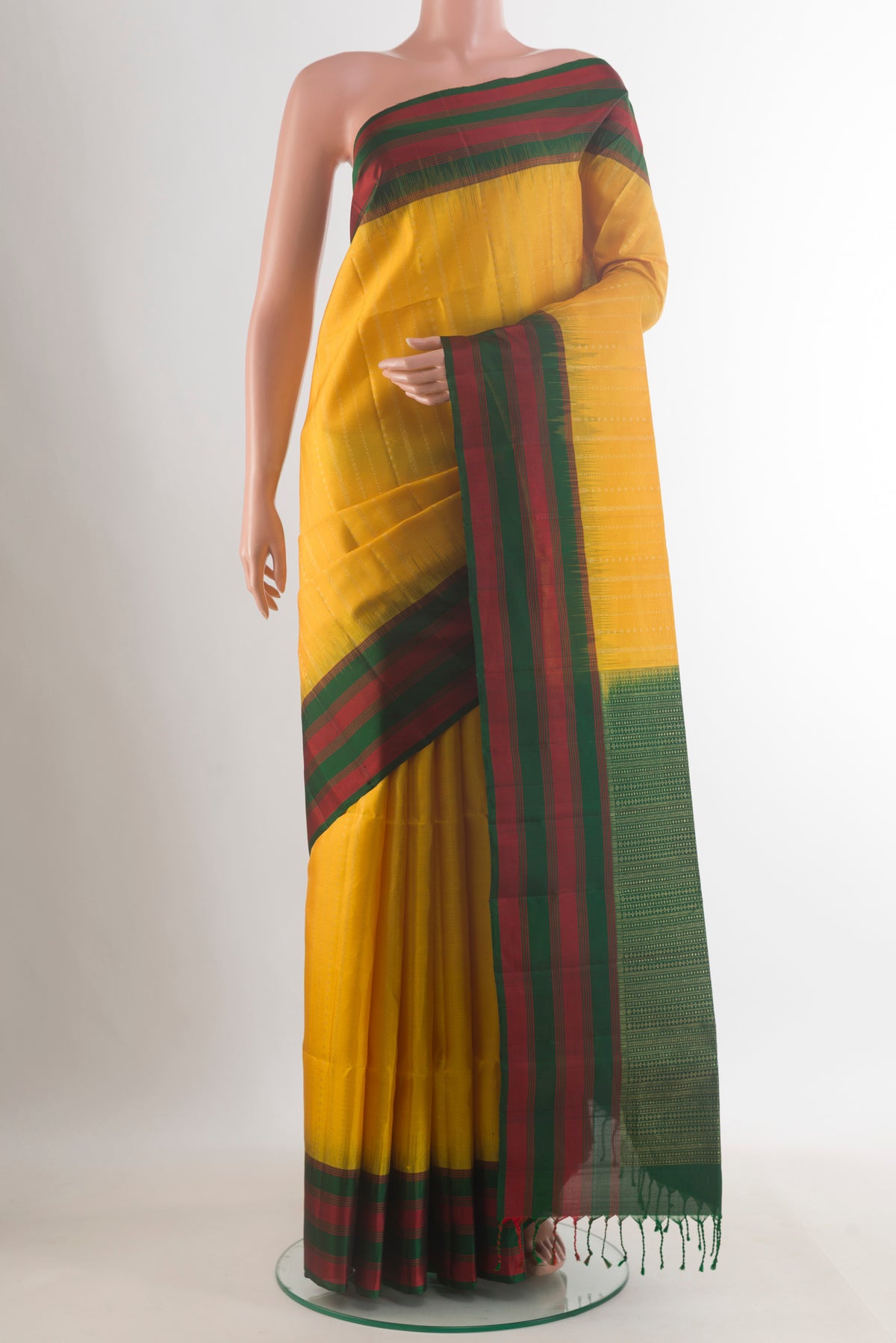 Pure Silk Yellow Soft Saree with Stripes on the body and Zari Border.  displayed on a mannequin