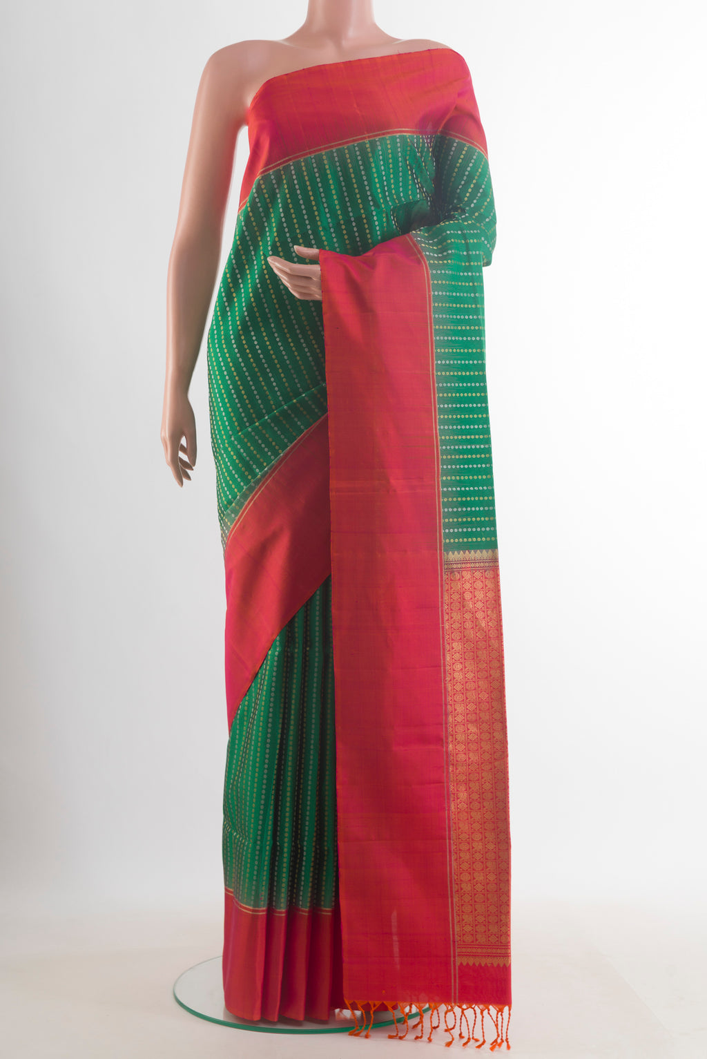 Pure Silk Green Soft Saree with Zari Butta on the body and Zari Border.  displayed on a mannequin