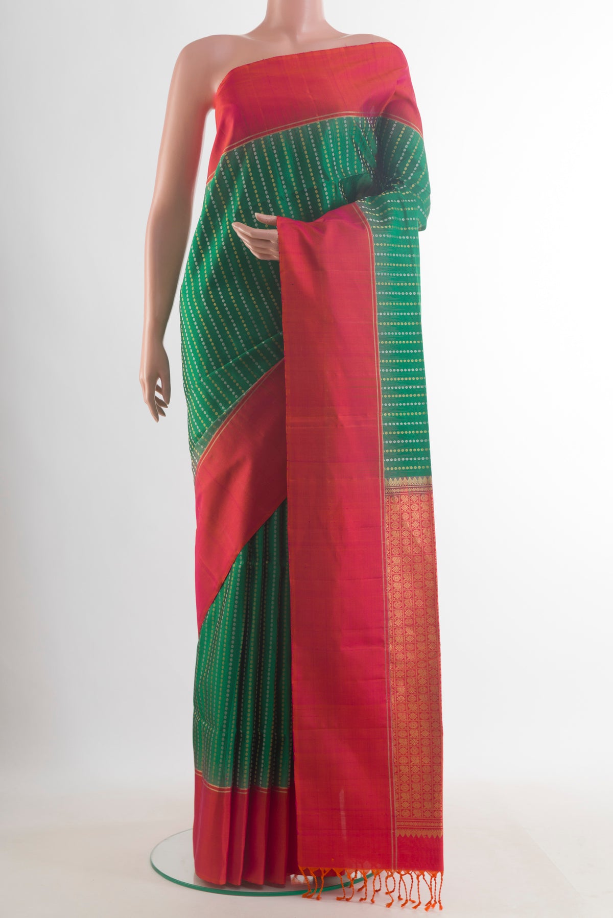 Pure Silk Green Soft Saree with Zari Butta on the body and Zari Border.  displayed on a mannequin