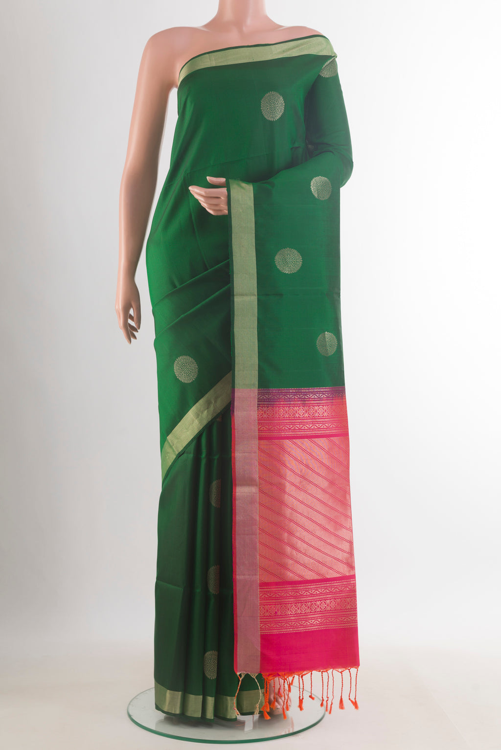 Pure Silk Green Soft Saree with Zari Butta on the body and Zari Border.  displayed on a mannequin