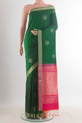 Pure Silk Green Soft Saree with Zari Butta on the body and Zari Border.  displayed on a mannequin