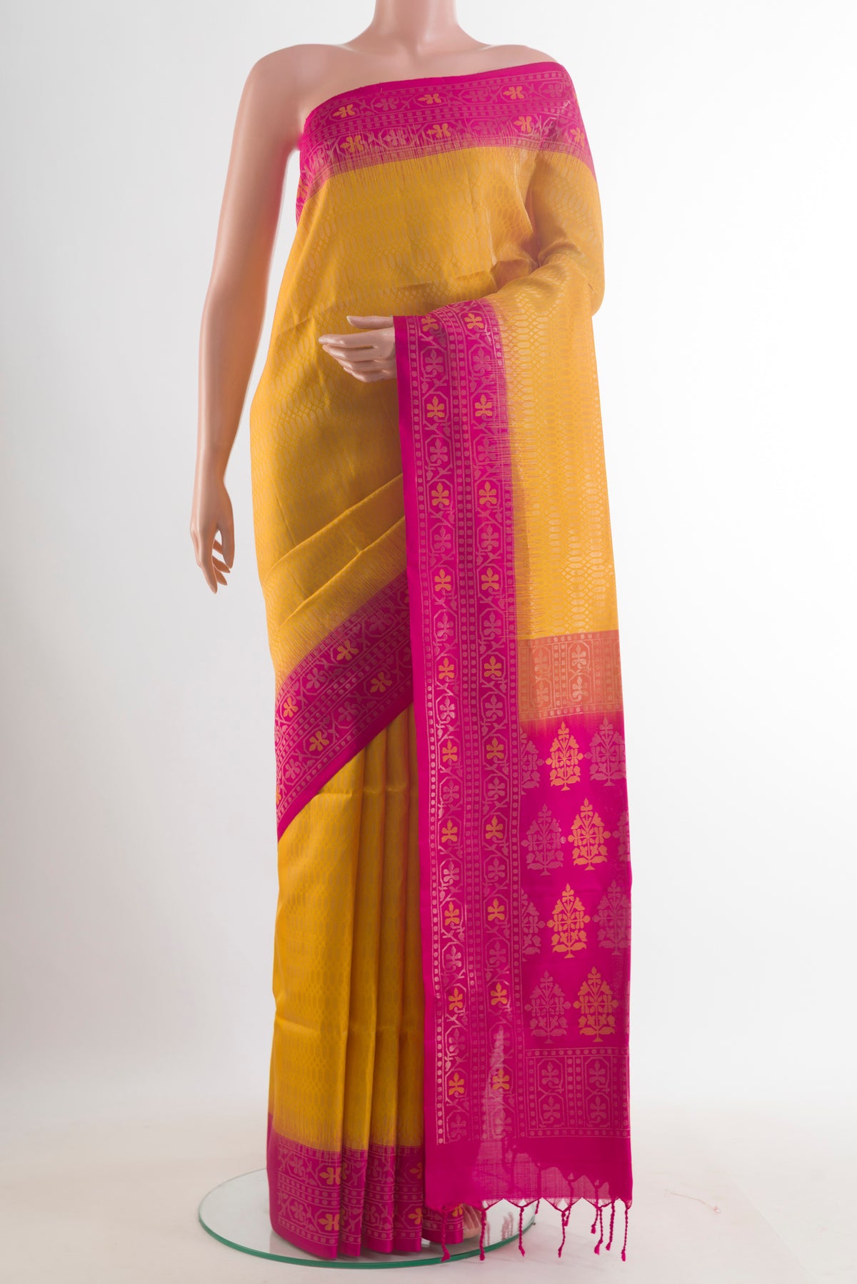 Pure Silk Yellow Soft Saree with Zari Brocade on the body and Zari Border.  displayed on a mannequin