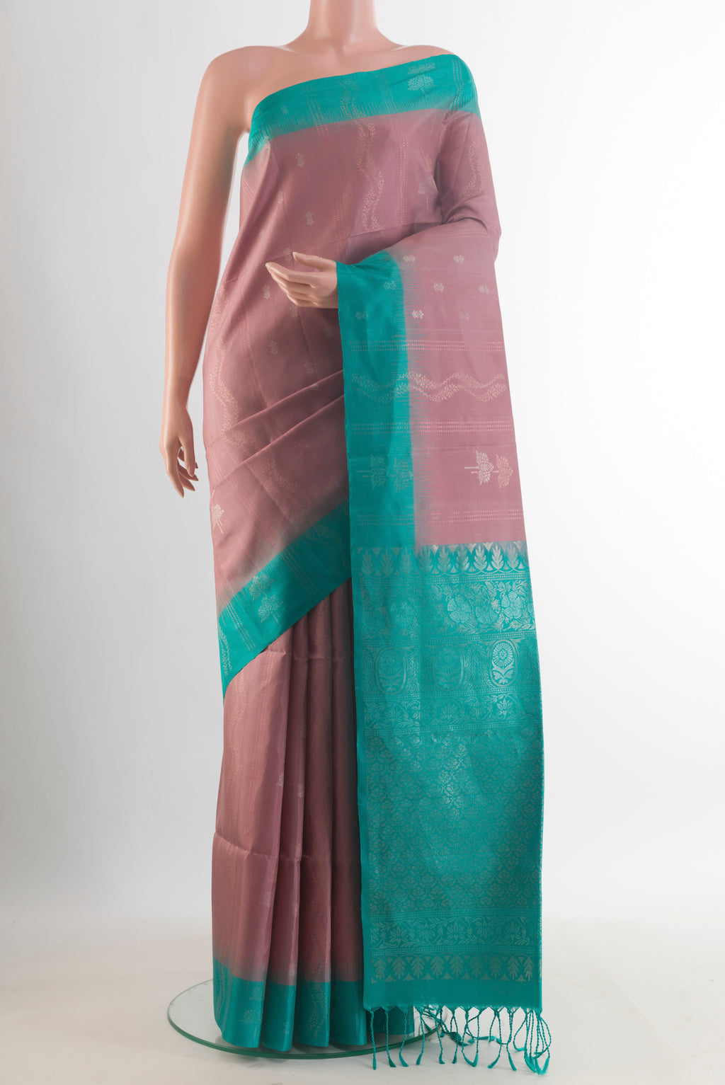 Pure Silk Rose Gold Soft Saree with Zari Butta on the body and Zari Border.  displayed on a mannequin