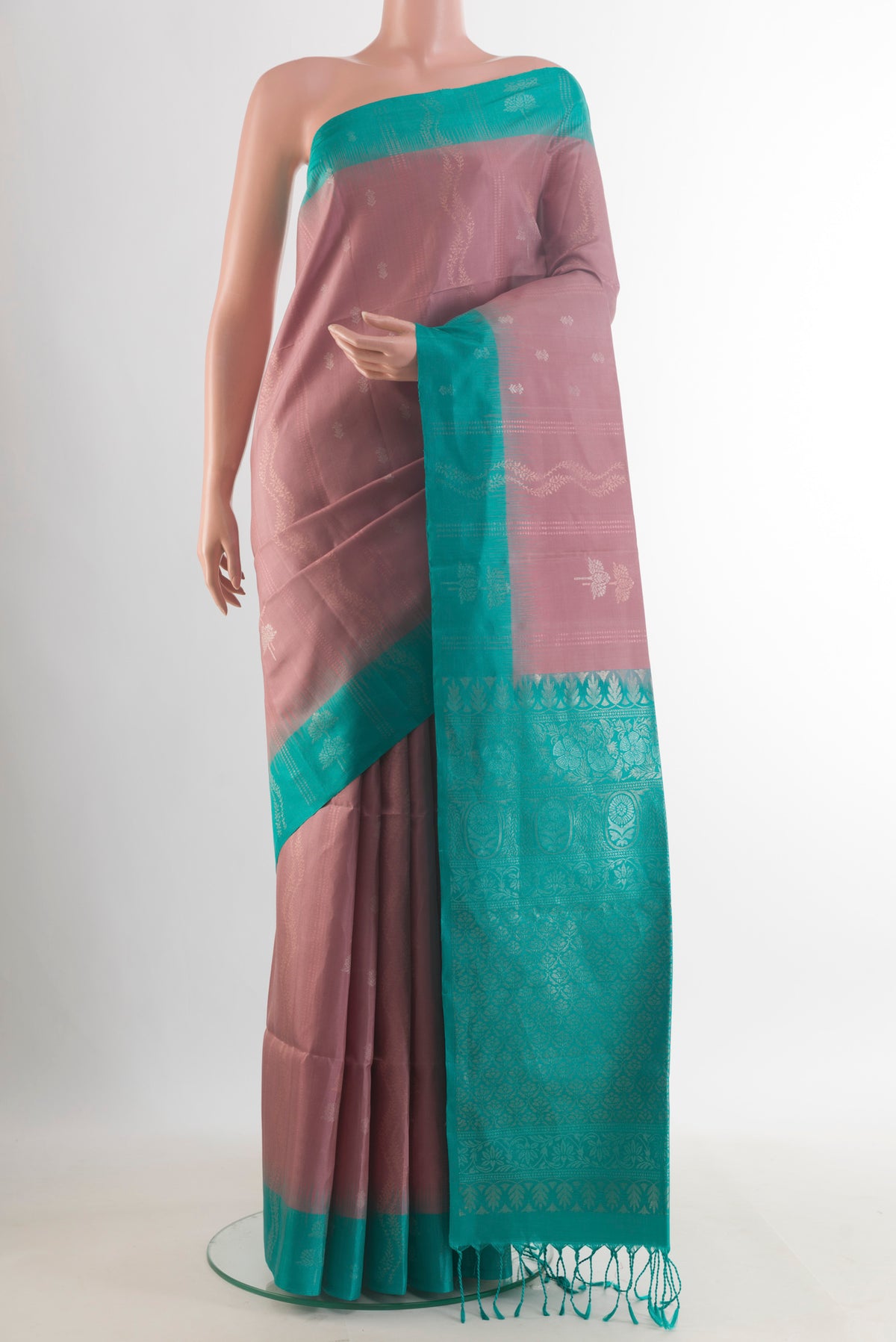Pure Silk Rose Gold Soft Saree with Zari Butta on the body and Zari Border.  displayed on a mannequin