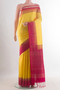 Pure Silk Yellow Soft Saree with Zari Butta on the body and Zari Border.  displayed on a mannequin