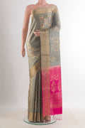 Pure Silk Grey Soft Saree with Ikat design on the body and Zari Border.  displayed on a mannequin