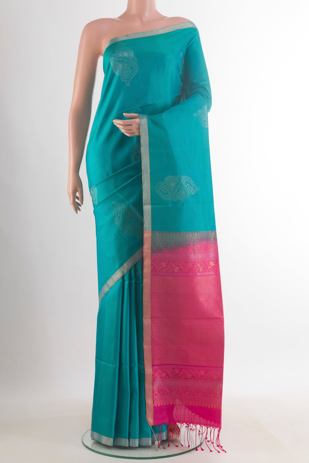 Pure Silk Blue Soft Saree with Zari Butta on the body and Zari Border.  displayed on a mannequin