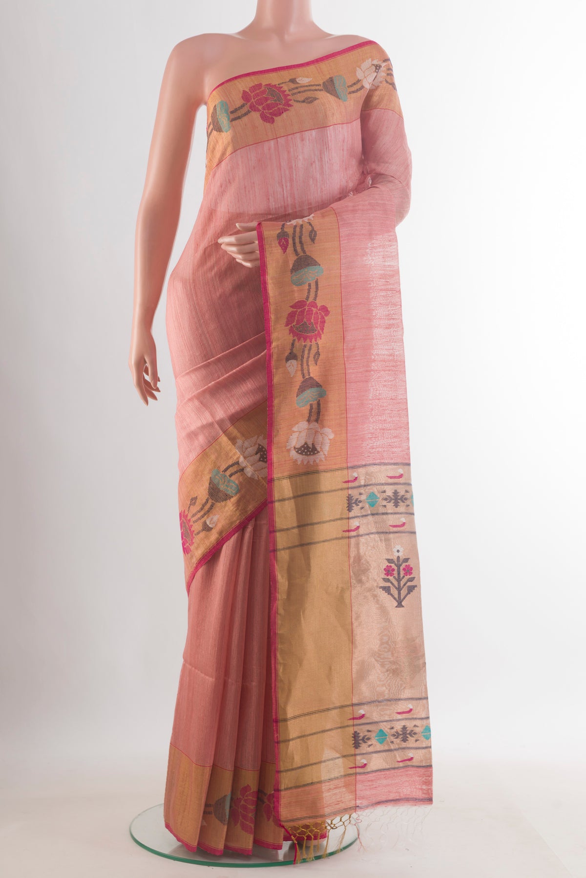 Peach Tussar Saree with Plain Body and Zari Border.  displayed on a mannequin