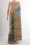 Beige Tussar Saree with Printed design on the body and Zari Border.  displayed on a mannequin