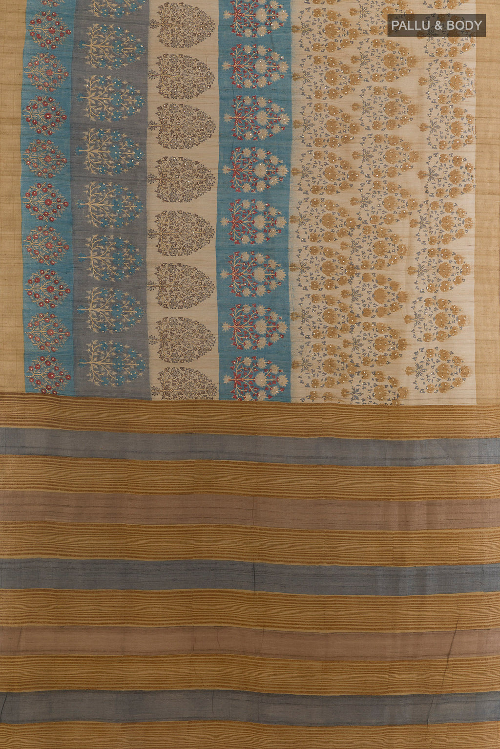 Flat view of Beige Tussar Saree with Printed design on the body and Zari Border. 