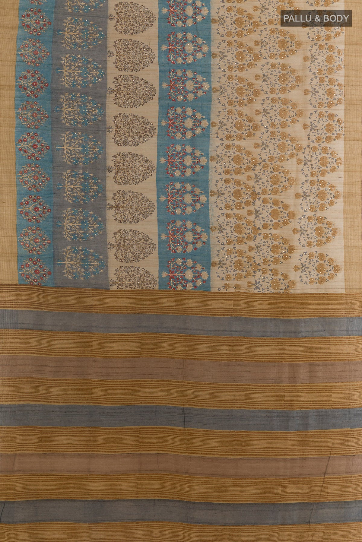 Flat view of Beige Tussar Saree with Printed design on the body and Zari Border. 
