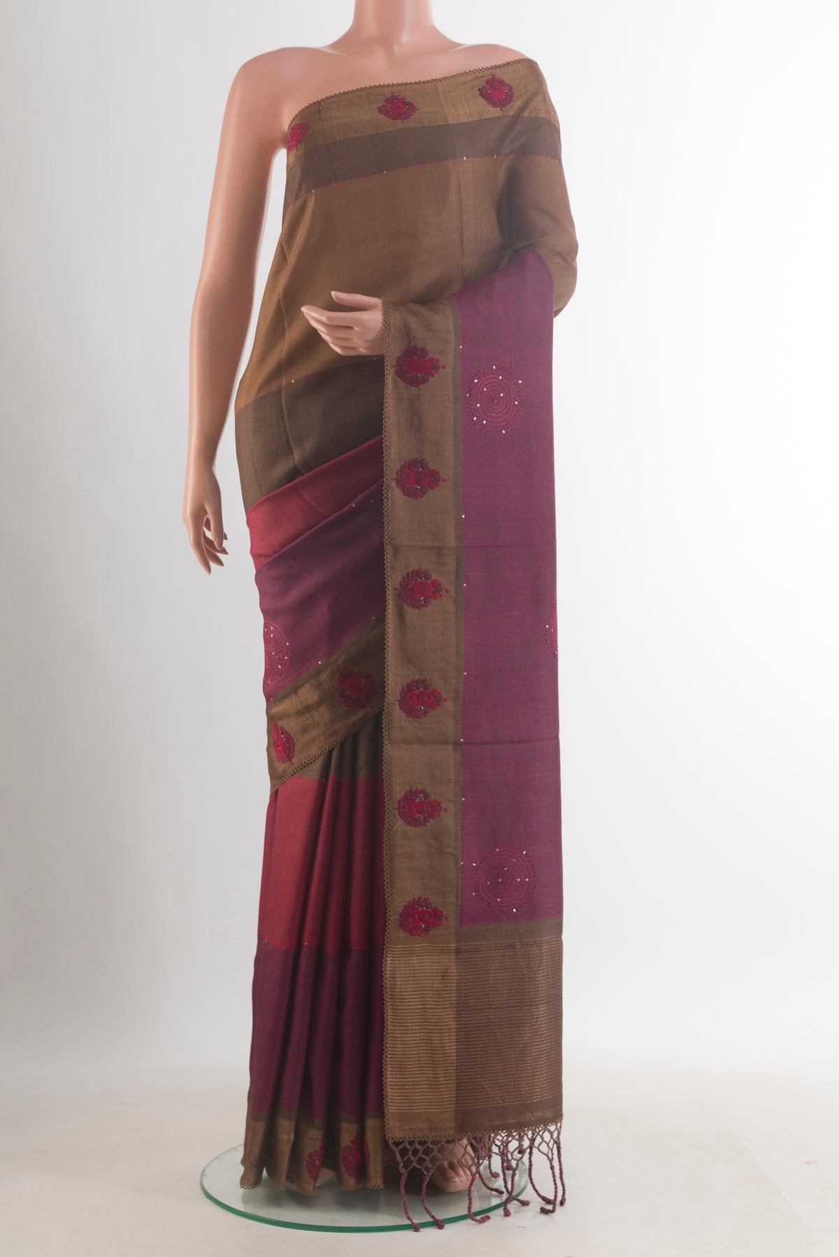 Multi Color Tussar Saree with Embroidered on the body and Zari Border.  displayed on a mannequin
