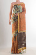 Mustard Tussar Saree with Batik Print on the body and Embroidered Border.  displayed on a mannequin