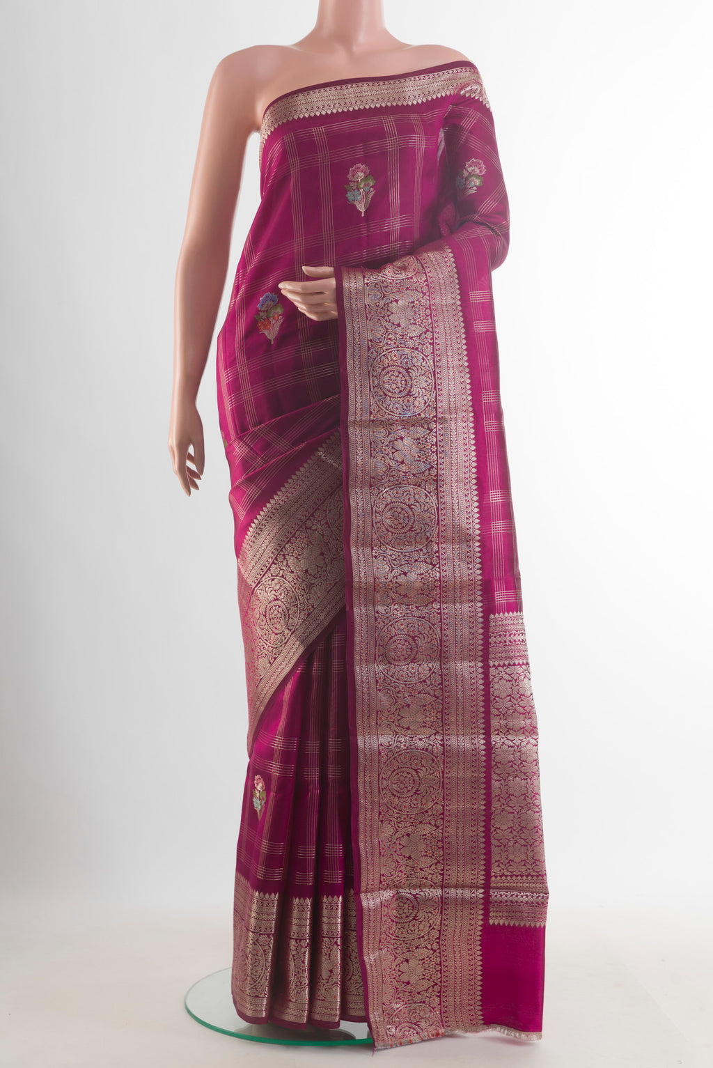 Pure Silk Magenta Banarasi Raw Saree with Checked design on the body and Zari Border.  displayed on a mannequin
