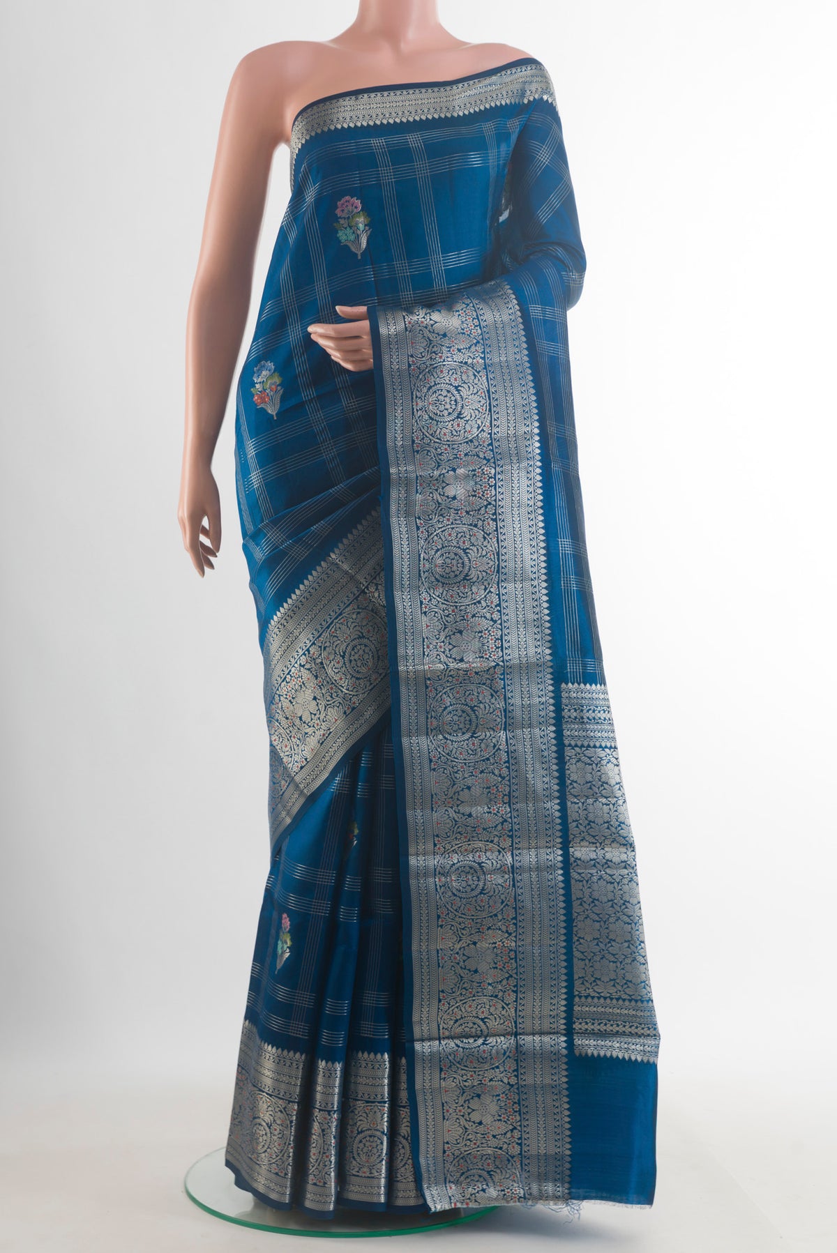 Pure Silk Blue Banarasi Tussar Saree with Checked design on the body and Zari Border.  displayed on a mannequin