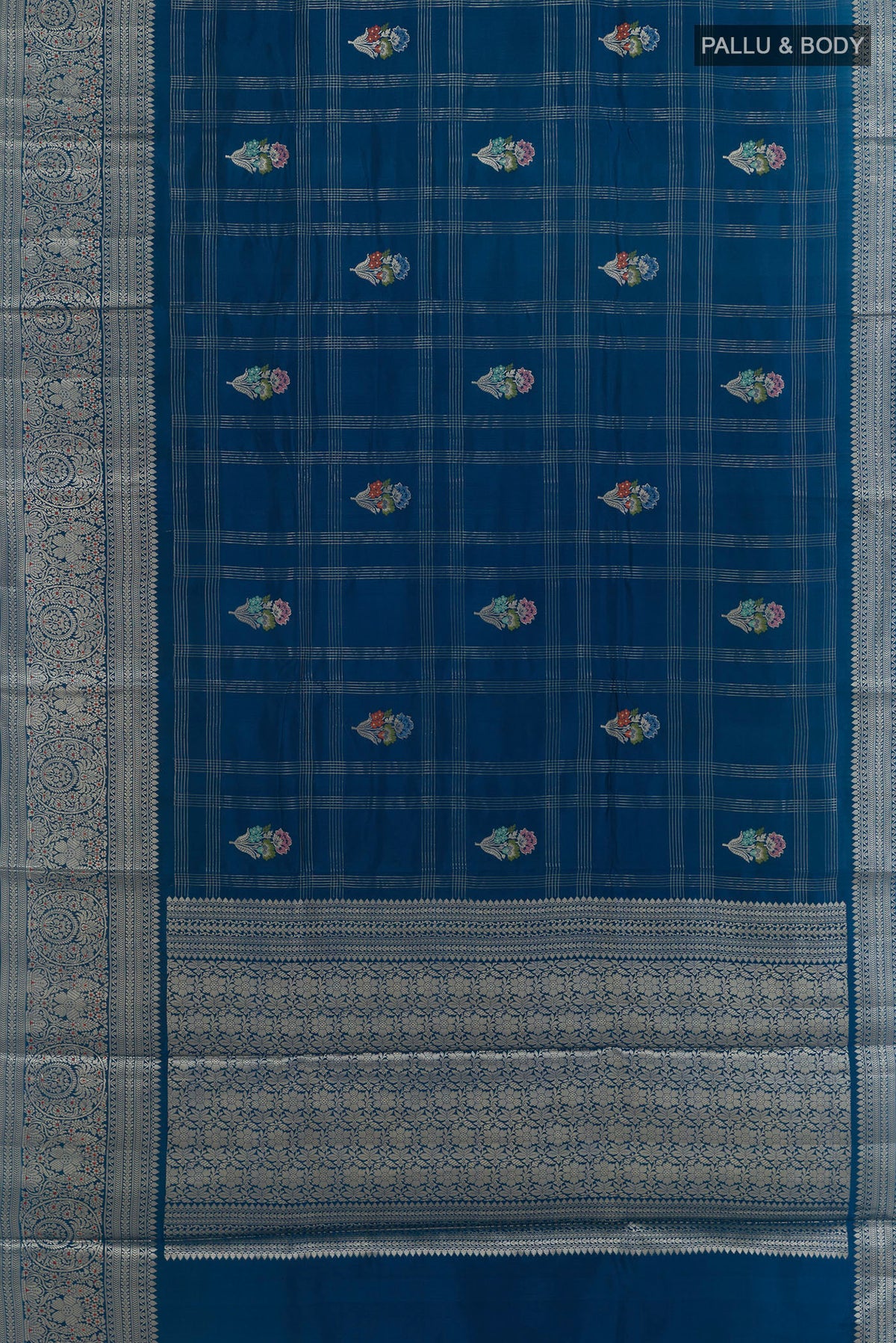 Flat view of Pure Silk Blue Banarasi Tussar Saree with Checked design on the body and Zari Border. 