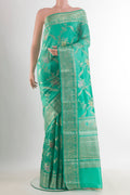 Sea Green Tussar Saree with Zari Brocade on the body and Zari Border.  displayed on a mannequin