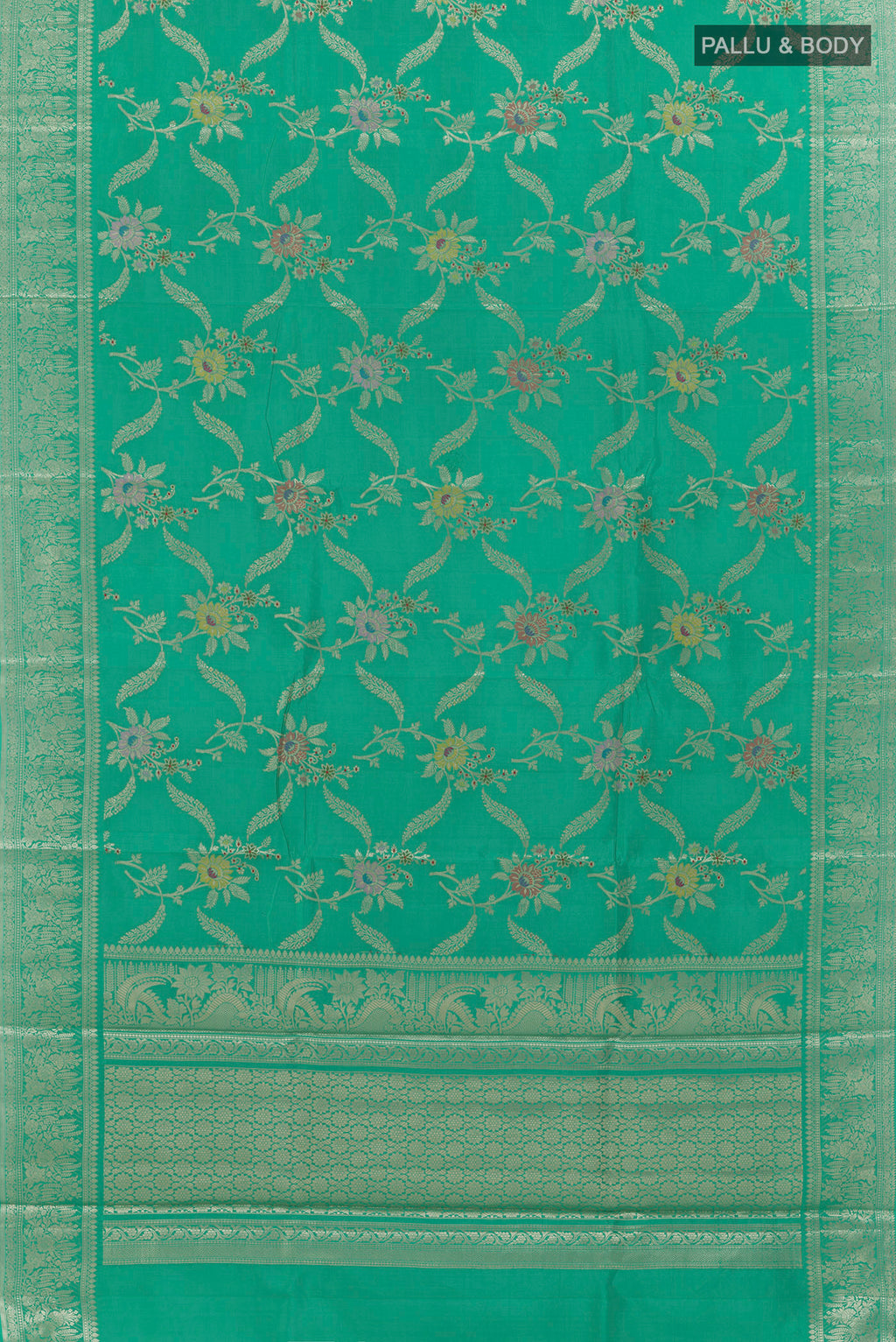 Flat view of Sea Green Tussar Saree with Zari Brocade on the body and Zari Border. 