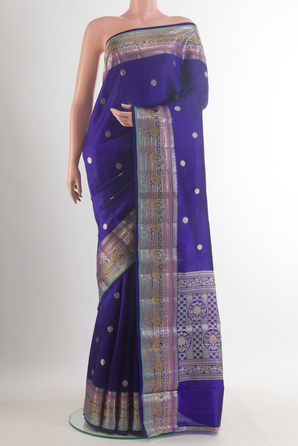 Blue Tussar Saree with Zari Butta on the body and Zari Border.  displayed on a mannequin