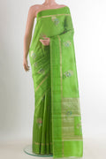 Green Tussar Saree with Zari Butta on the body and Zari Border.  displayed on a mannequin