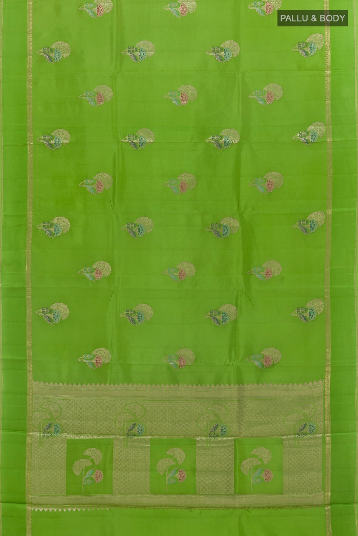 Flat view of Green Tussar Saree with Zari Butta on the body and Zari Border. 