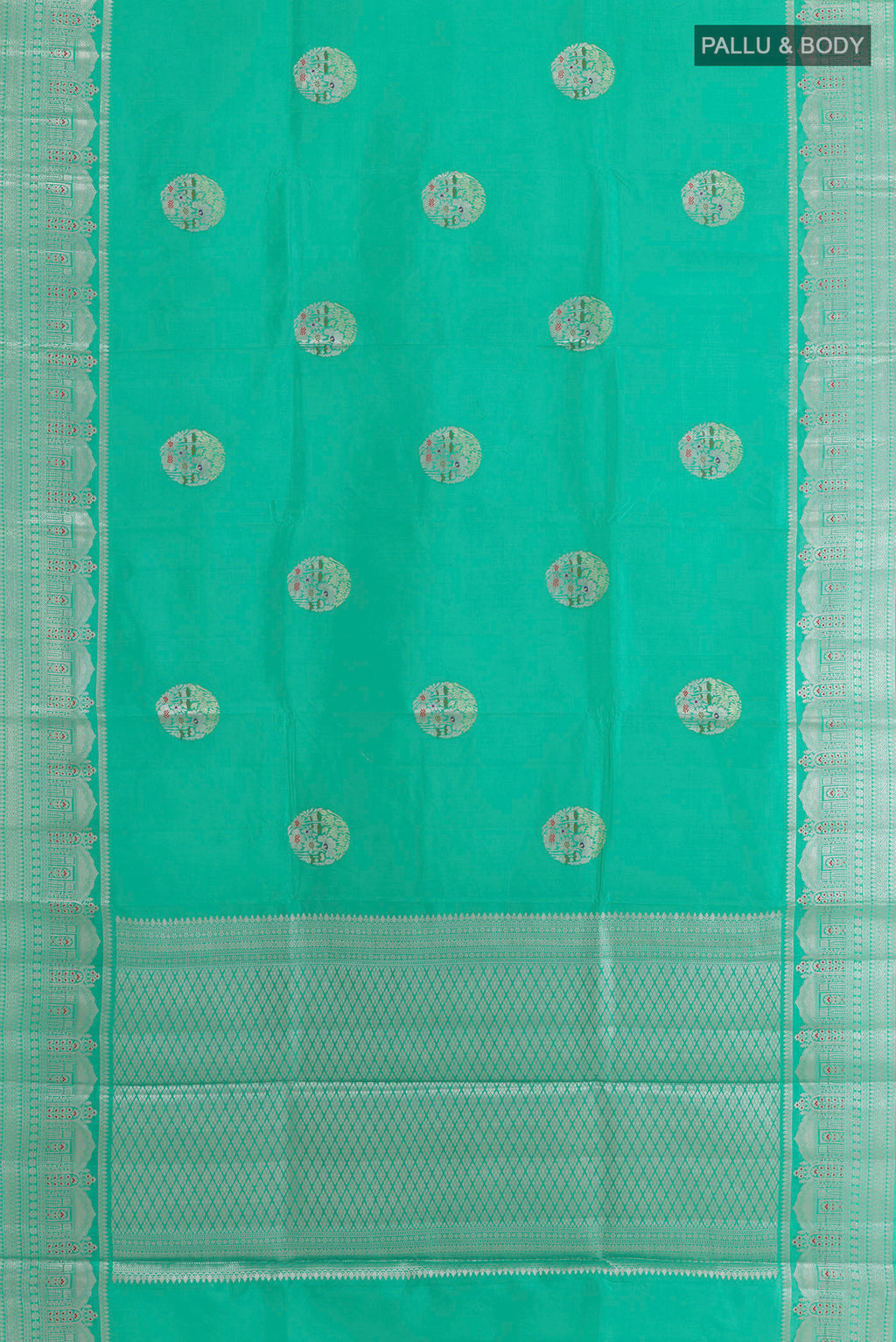 Flat view of Sea Green Tussar Saree with Zari Butta on the body and Zari Border. 