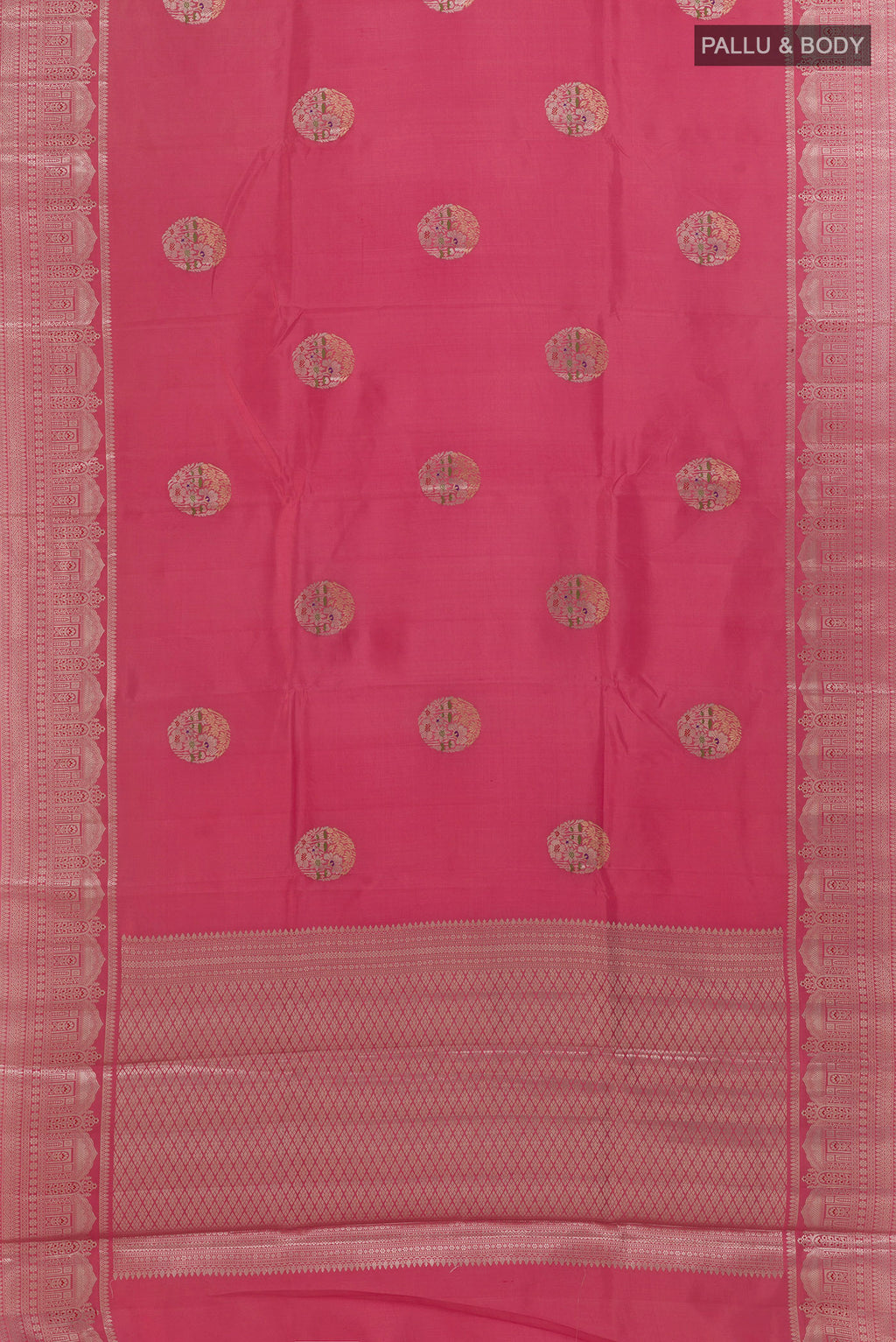 Flat view of Pink Tussar Saree with Zari Butta on the body and Zari Border. 