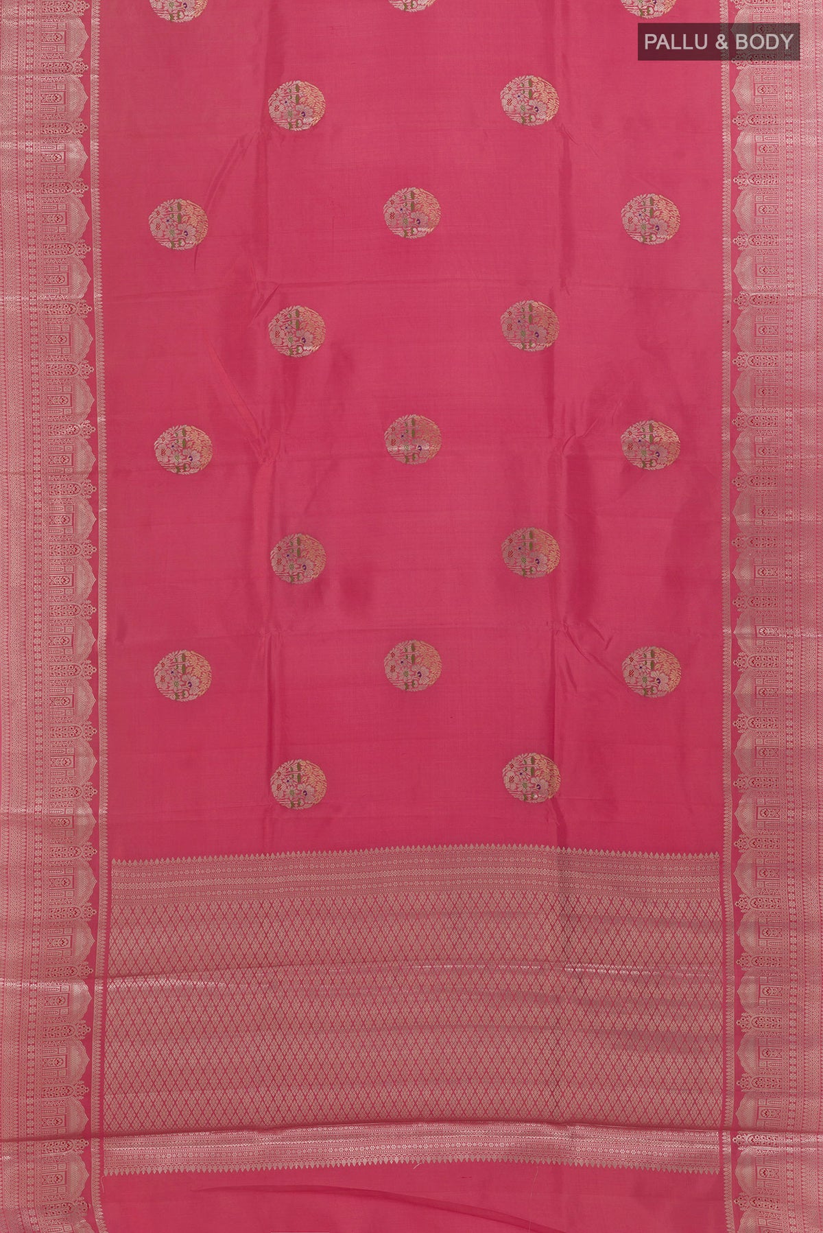 Flat view of Pink Tussar Saree with Zari Butta on the body and Zari Border. 