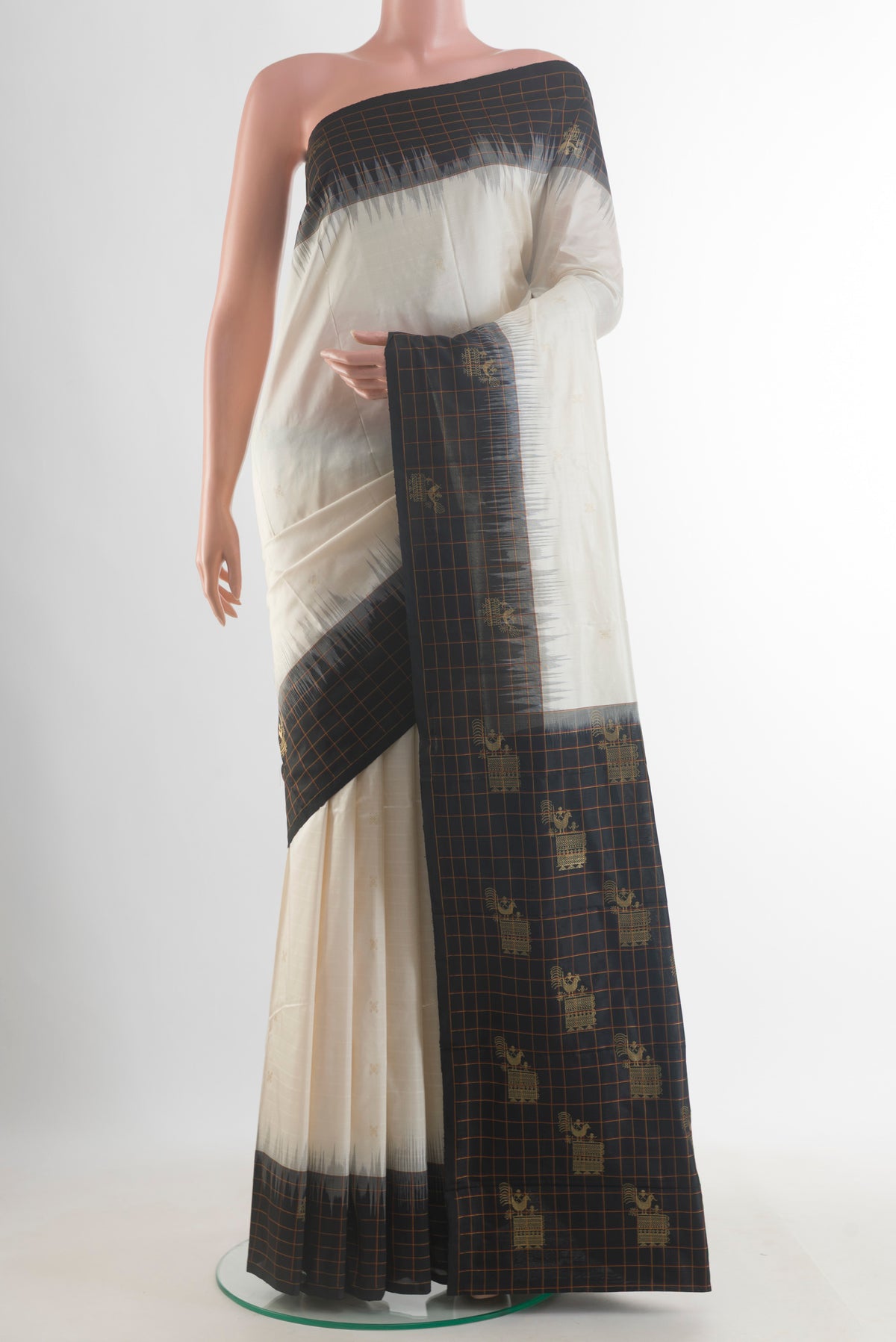 Pure Silk Off White Kanchipuram Saree with Zari Butta on the body and Zari Border.  displayed on a mannequin