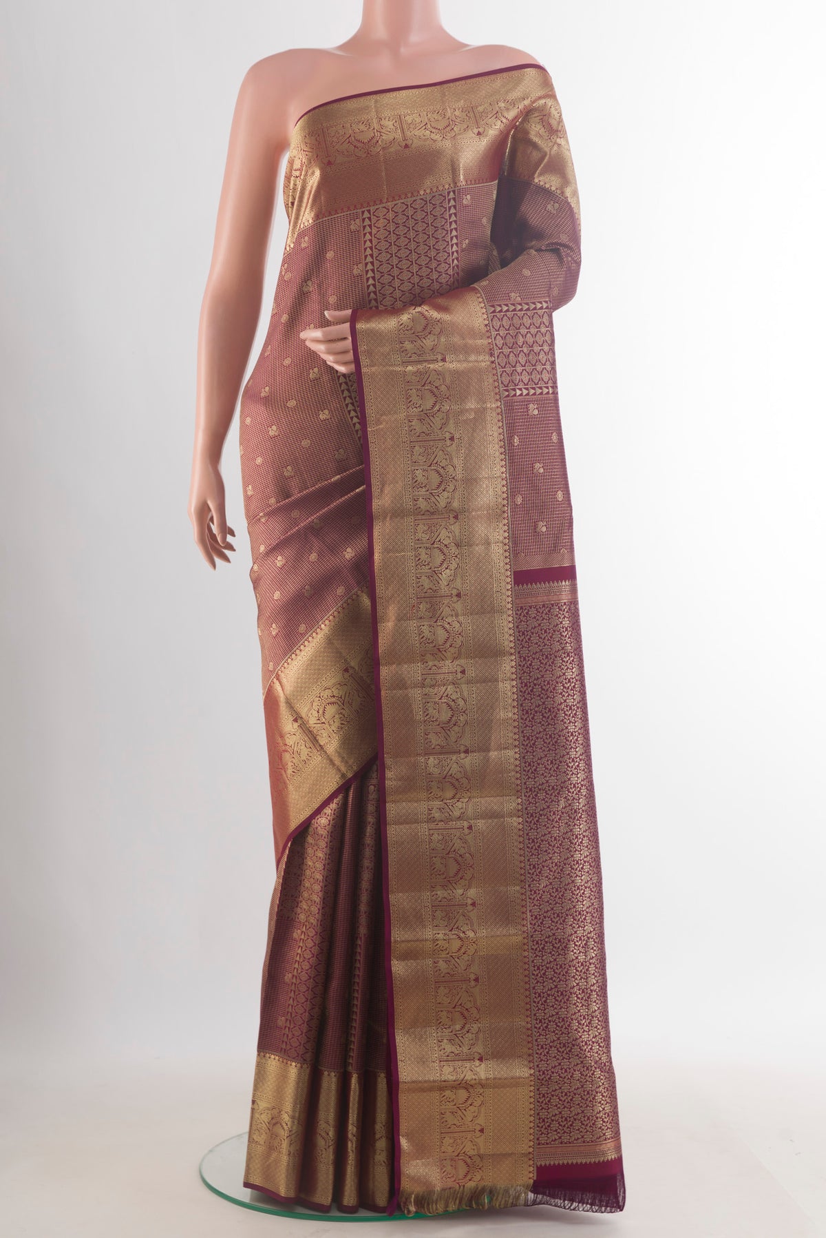 Pure Silk Magenta Kanjivaram Saree with Zari Brocade on the body and Zari Border.  displayed on a mannequin