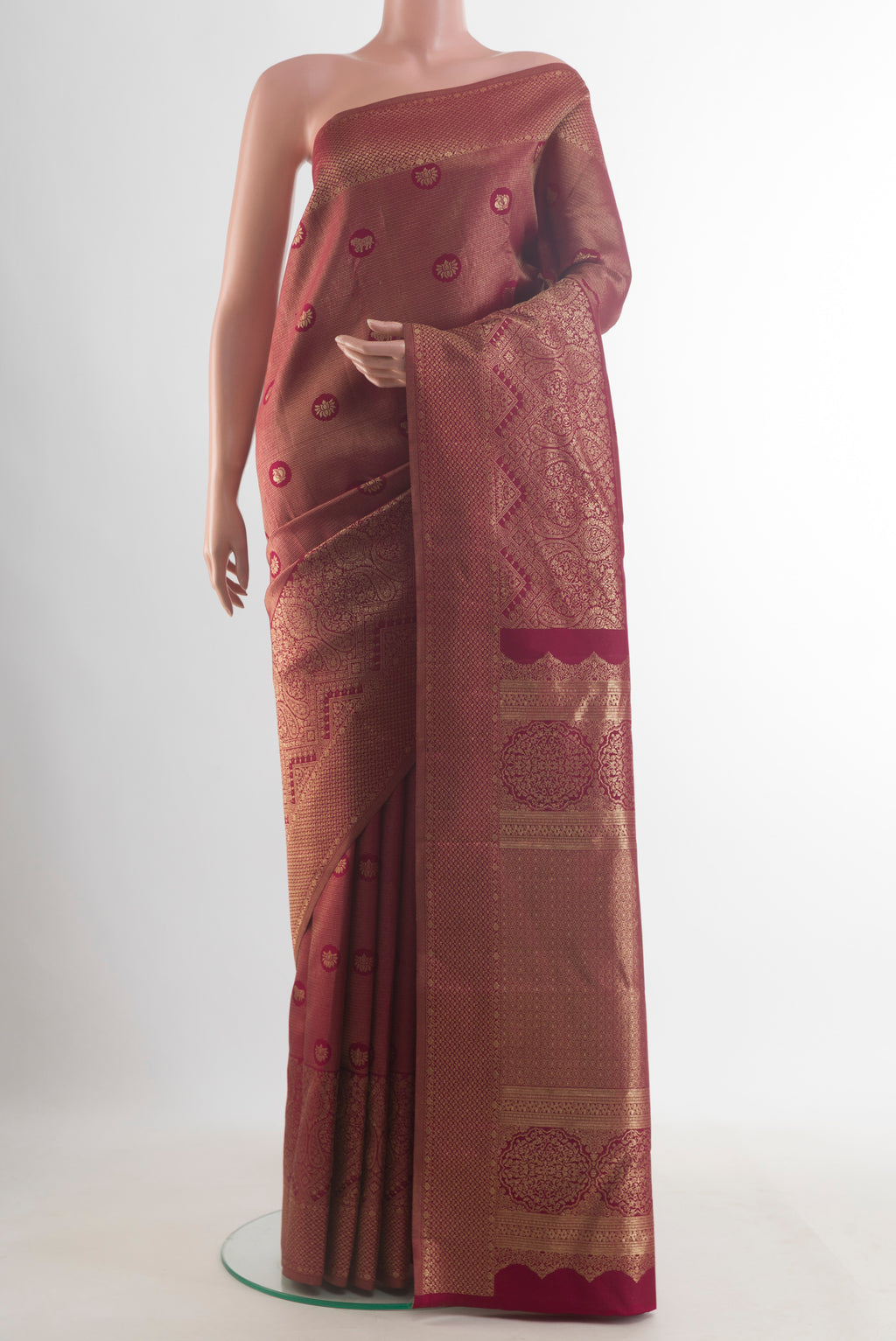 Pure Silk Maroon Kanjivaram Saree with Zari Brocade on the body and Zari Border.  displayed on a mannequin
