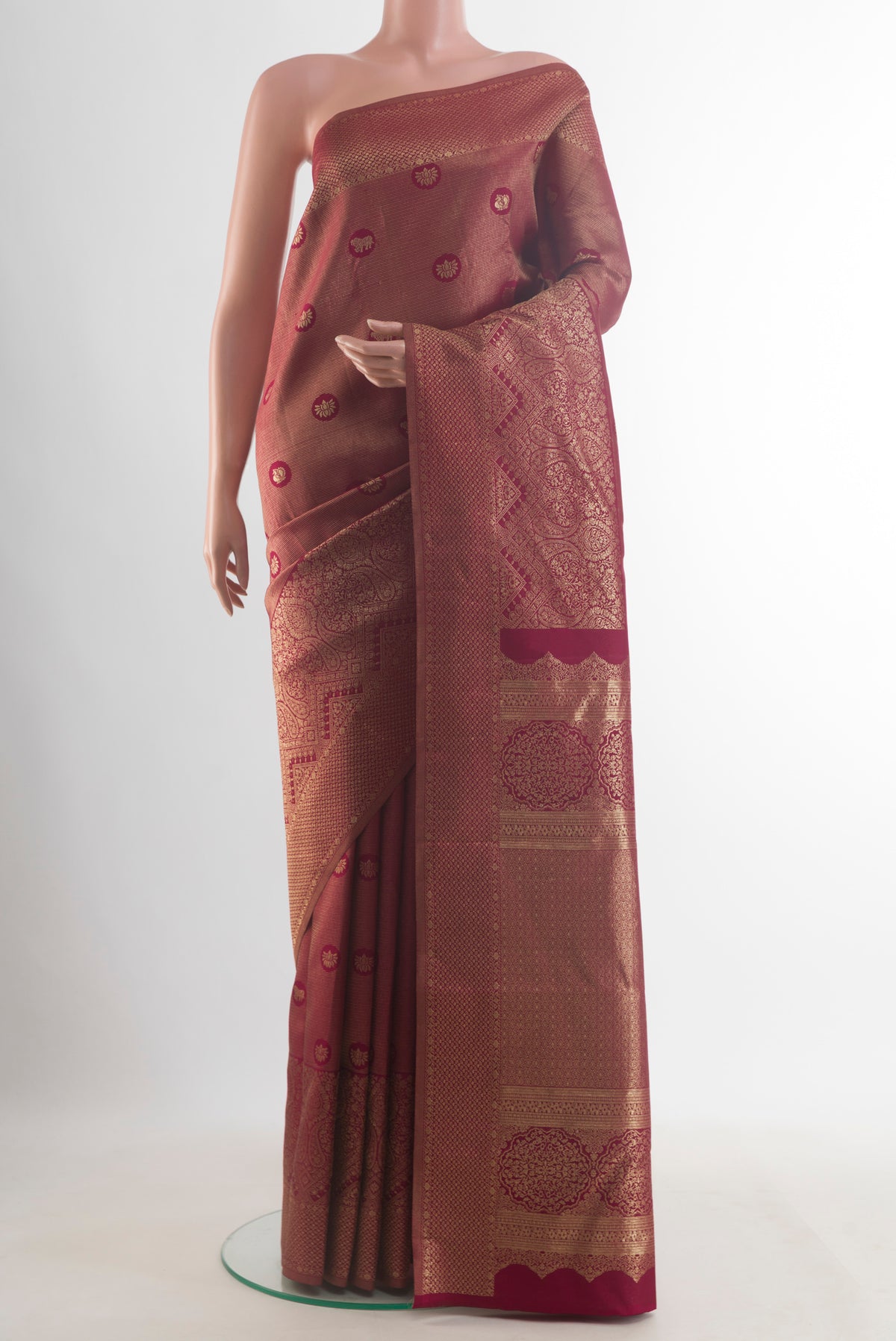 Pure Silk Maroon Kanjivaram Saree with Zari Brocade on the body and Zari Border.  displayed on a mannequin