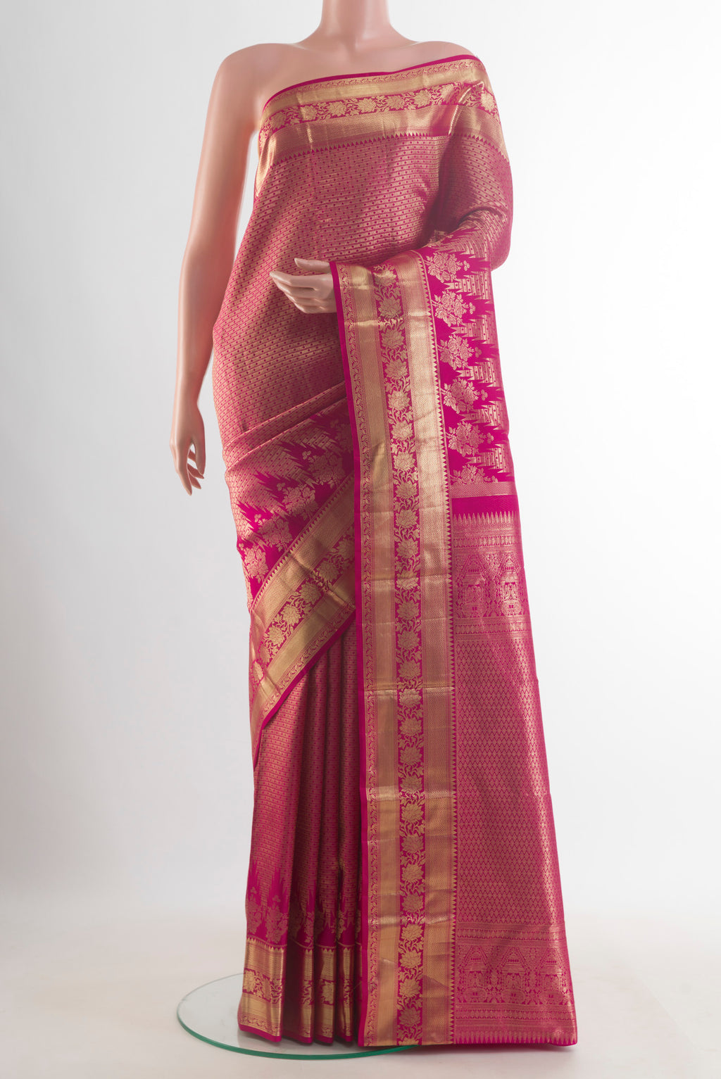 Pure Silk Pink Kanjivaram Saree with Zari Brocade on the body and Zari Border.  displayed on a mannequin