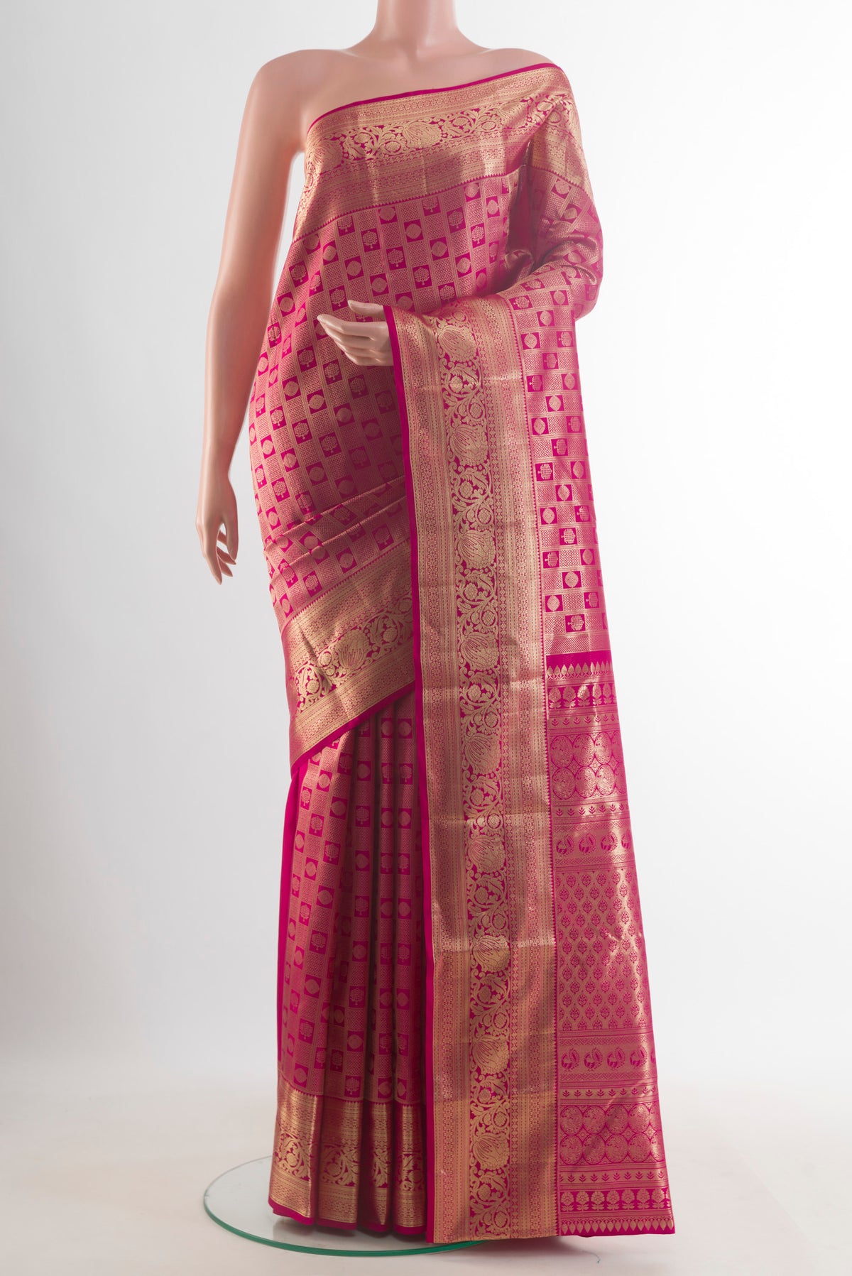 Pure Silk Dark Pink Kanjivaram Saree with Zari Brocade on the body and Zari Border.  displayed on a mannequin