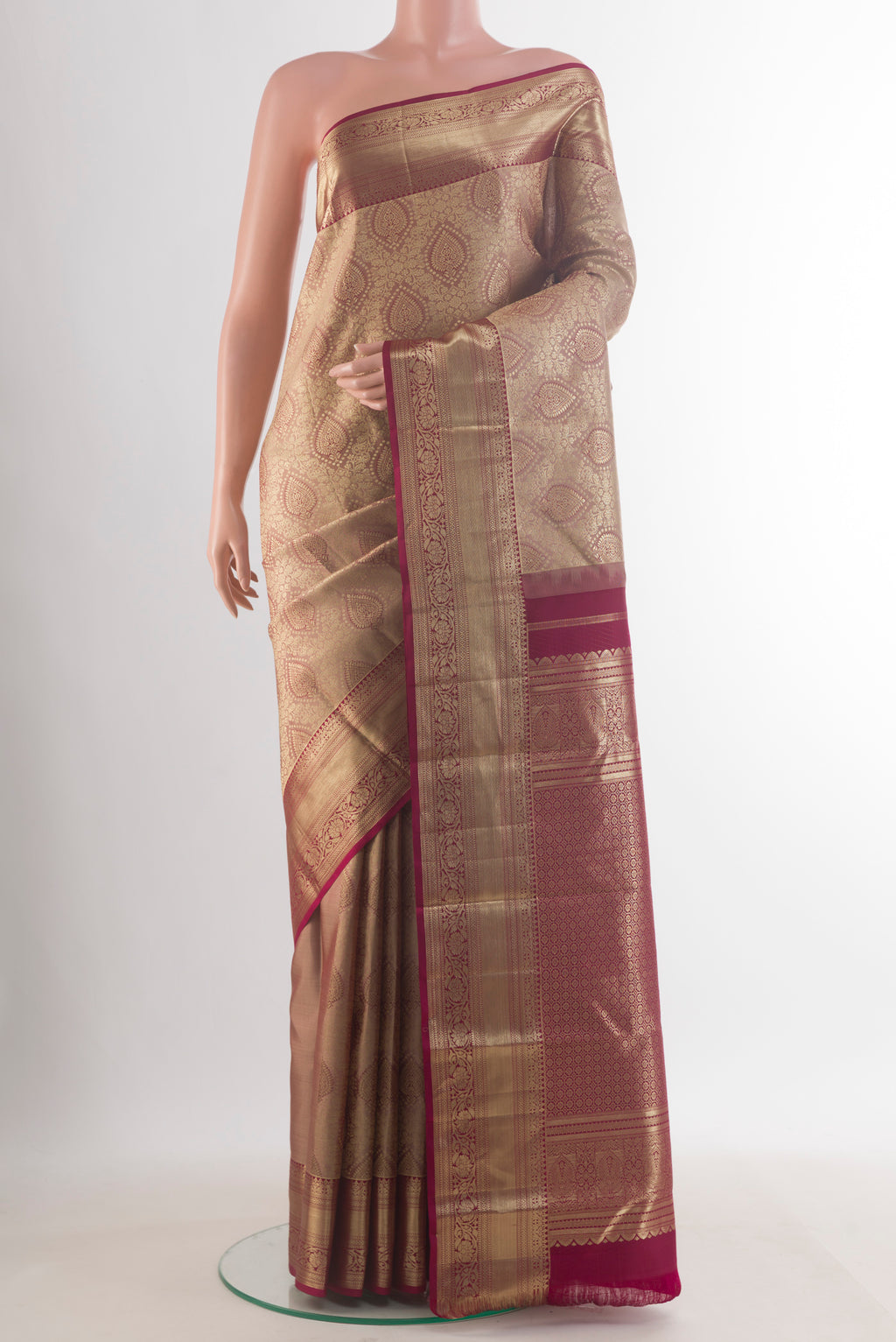 Pure Silk Beige Kanjivaram Saree with Zari Brocade on the body and Zari Border.  displayed on a mannequin
