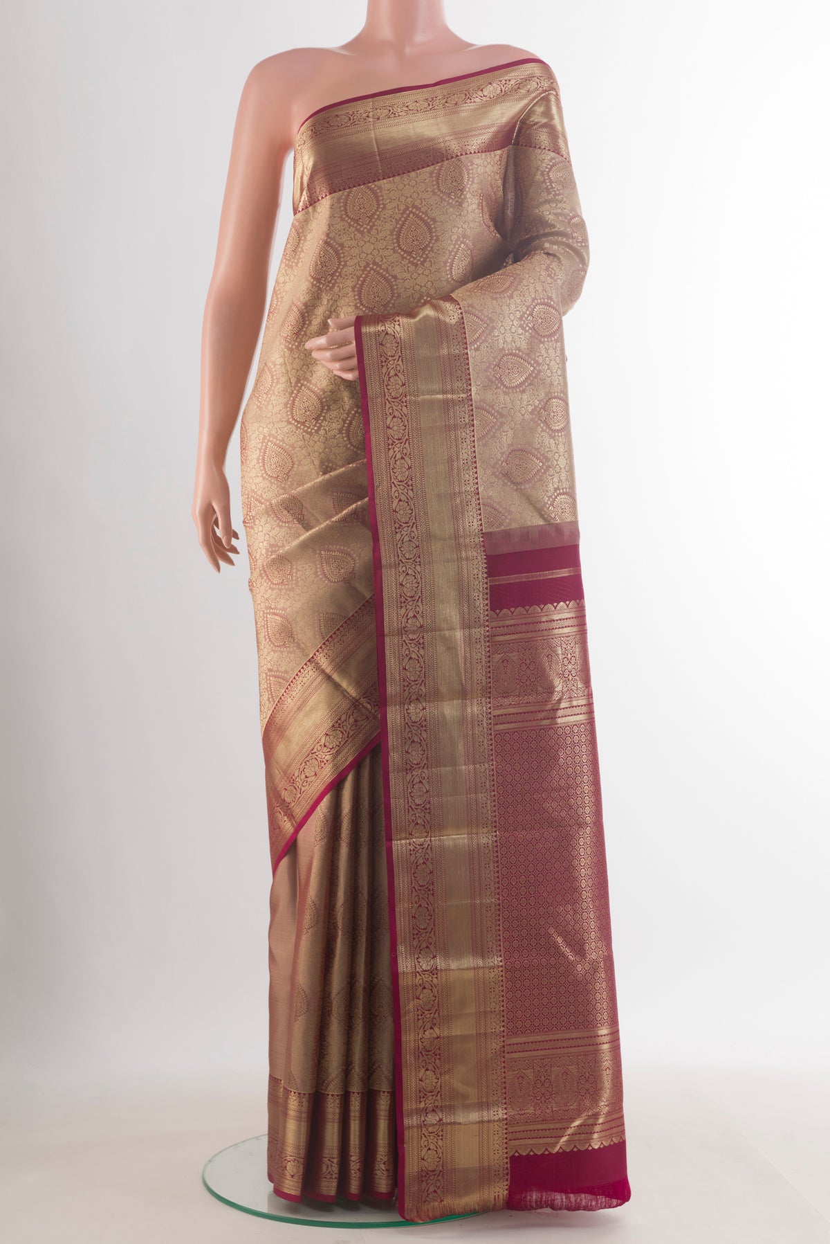 Pure Silk Beige Kanjivaram Saree with Zari Brocade on the body and Zari Border.  displayed on a mannequin