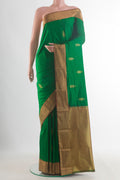 Pure Silk Green Bangalore Saree with Zari Butta on the body and Zari Border.  displayed on a mannequin