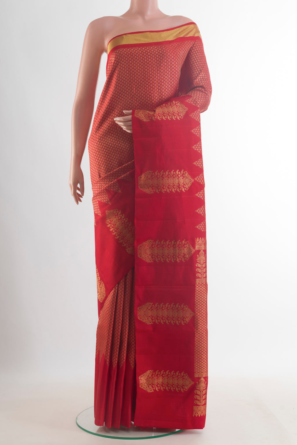 Pure Silk Red Kanjivaram Saree with Zari Brocade on the body and Zari Border.  displayed on a mannequin