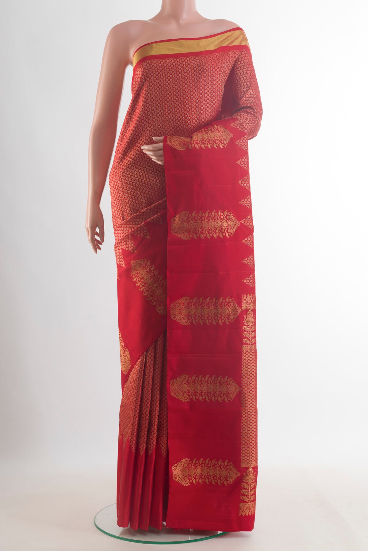 Pure Silk Red Kanjivaram Saree with Zari Brocade on the body and Zari Border.  displayed on a mannequin