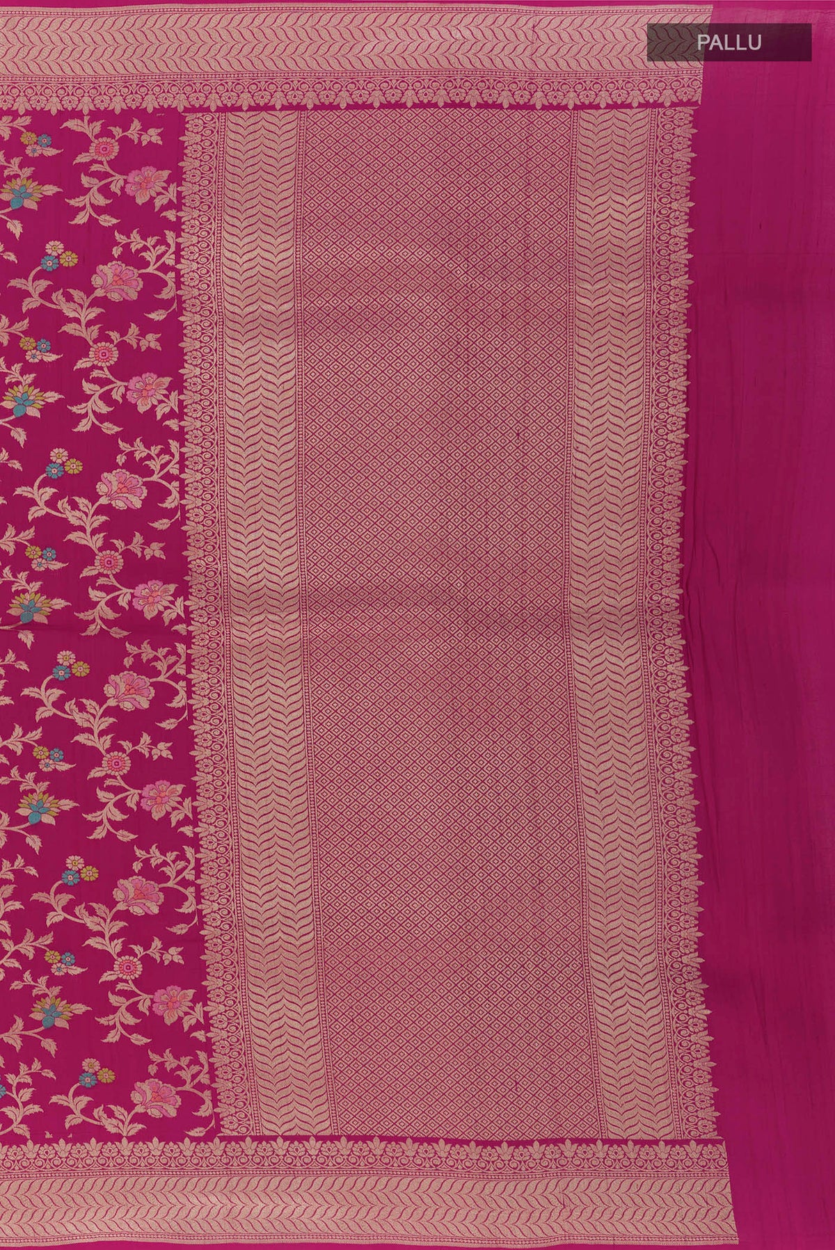 Close up image of the pallu of Rani Pink Banarasi Tussar Saree with Zari Brocade on the body and Zari Border. 