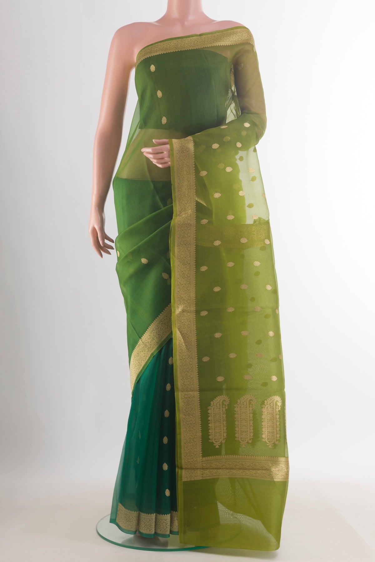 Pure Silk Multi Color Banarasi Kora Saree with Zari Butta on the body and Zari Border.  displayed on a mannequin