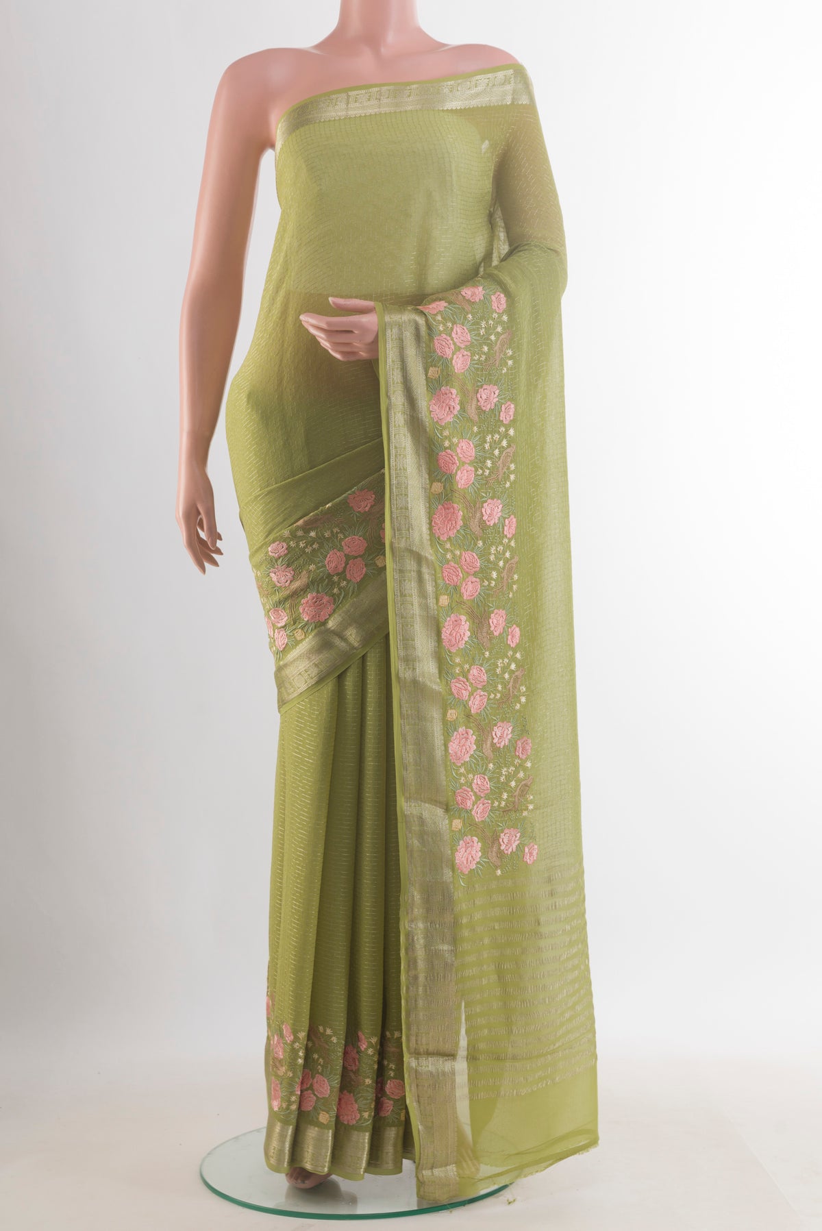 Green Mysore Georgette Saree with Checked design on the body and Embroidered Border.  displayed on a mannequin
