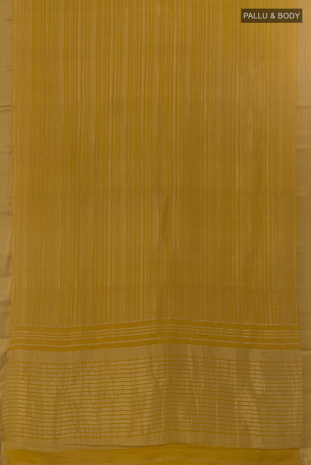 Flat view of Mustard Mysore Crepe Saree with Zari Brocade on the body and Zari Border. 