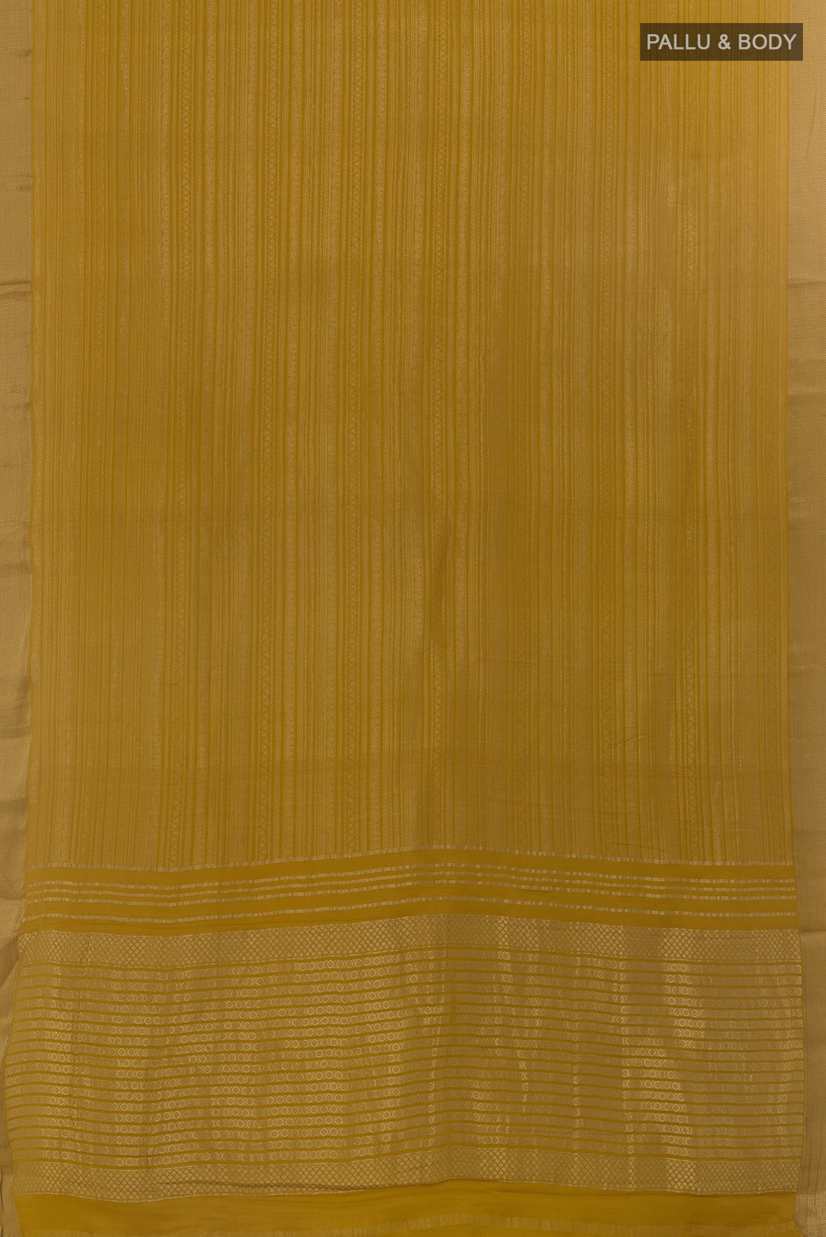Flat view of Mustard Mysore Crepe Saree with Zari Brocade on the body and Zari Border. 