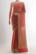 Orange Mysore Crepe Saree with Stripes on the body and Zari Border.  displayed on a mannequin